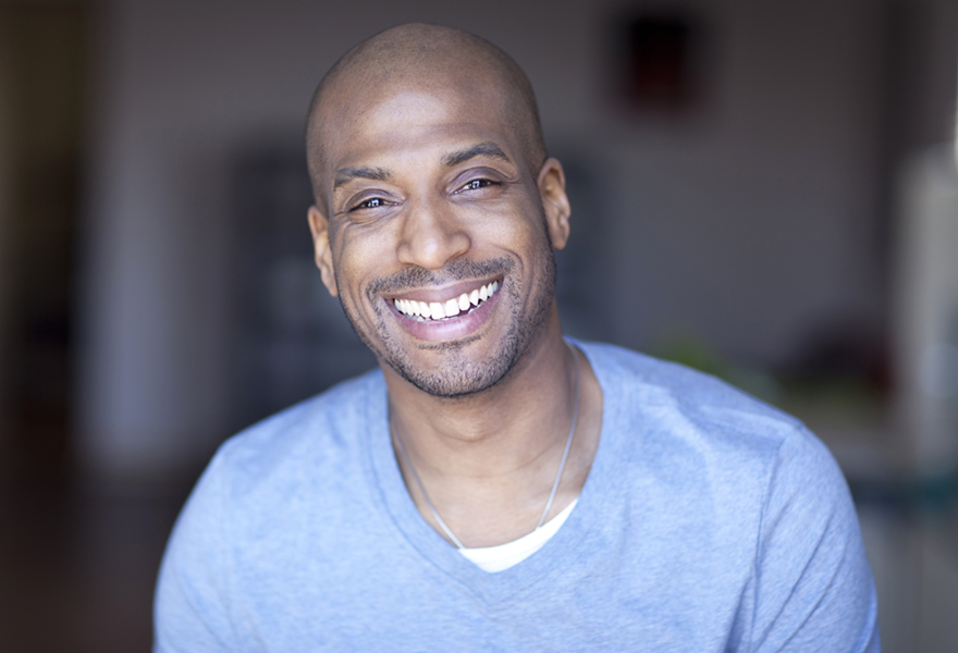 Portrait Of A Mature Black Man Smiling At Home