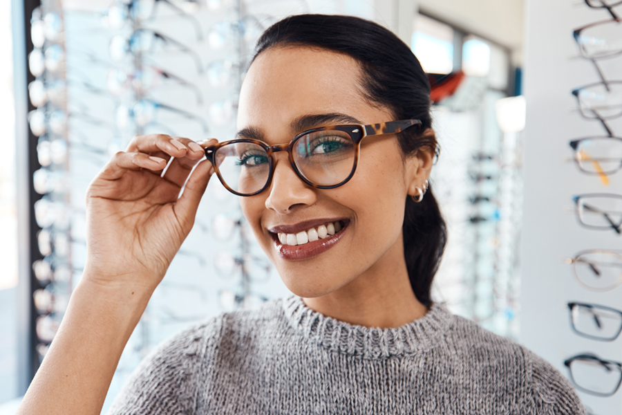Woman wearing glasses at an optical shop